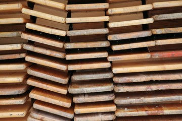 close up of a stack from Folded wood party tables and benches