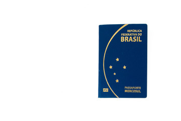 New Brazilian passport in a white background. with a write space. Novo Passaporte Brasileiro.