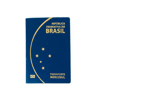 New Brazilian passport in a white background. with a write space. Passaporte Brasileiro, em fundo branco, com espa&ccedil;o para escrita.