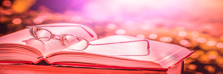 Stack of books in the library and blur background	