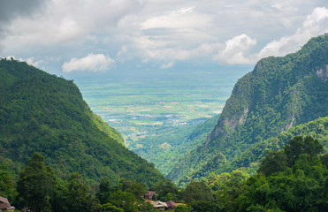 Naklejka premium Beautiful landscape of Doi Pha Hi an intricate mountain range in Mae Sai district of Chiang Rai province of Thailand in rainy season.