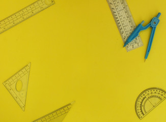 A school supplies on a yellow background