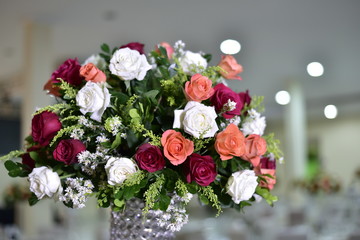 A luxurious bouquet of fresh flowers in a crystal vase on the holiday table and an elegant portion in the restaurant.