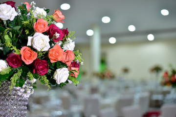 A luxurious bouquet of fresh flowers in a crystal vase on the holiday table and an elegant portion in the restaurant.