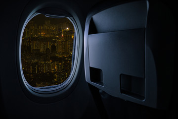 Beautiful scenic city view of night through the aircraft window.