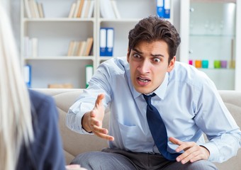The young man visiting psychiatrist doctor for consultation