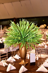 A luxurious bouquet of fresh flowers in a crystal vase on the holiday table and an elegant portion in the restaurant.