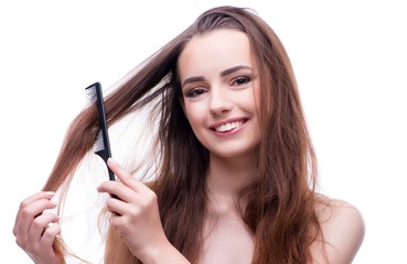 Obraz premium Woman in beauty concept combing hair