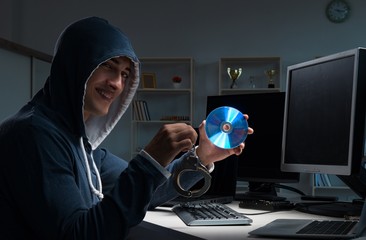 Hacker hacking computer at night