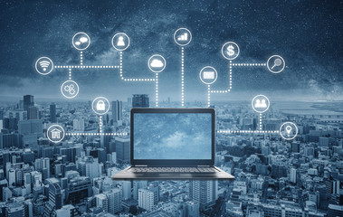 Computer laptop with application programming and social media icons