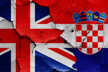 flags of UK and Croatia painted on cracked wall