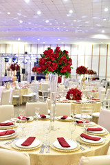 Table setting with glasses, plates, napkins and food