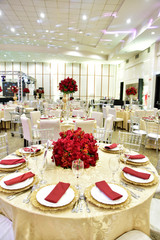 Table setting with glasses, plates, napkins and food