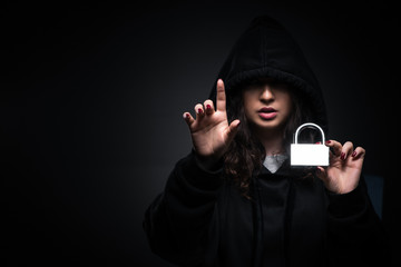 Female hacker hacking security firewall late in office