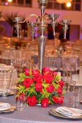 A luxurious bouquet of fresh flowers in a crystal vase on the holiday table and an elegant portion in the restaurant.