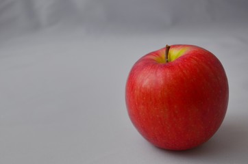 red apple on a black background