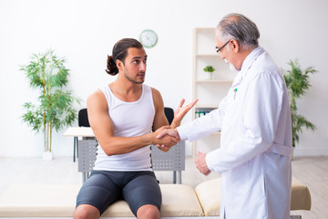 Young male patient visiting experienced doctor