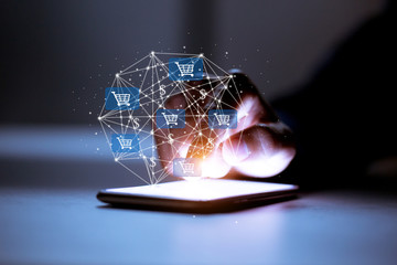 Business using smartphone,with shopping cart icon,sale volume increase make business growth and...