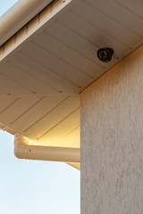 White plastic sewage system and surveillance camera of a private house.