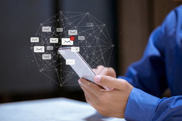 Business using smartphone,with email icon,email inbox electronic communication graphics concept.