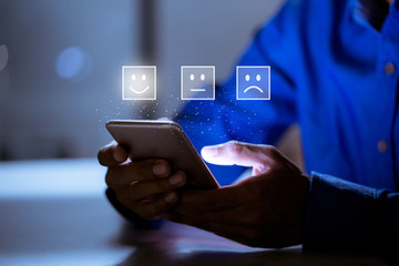 Business customer pressing smiley face emoticon online, Service rating, satisfaction concept.