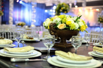 Table setting with glasses, plates, napkins and food