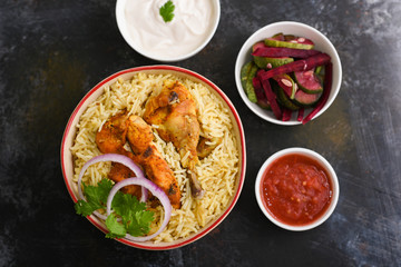 Chicken or Mutton Biryani, Pulao spicy mixed rice dish with meat curry, almonds during Ramadan festival Hyderabad, India.