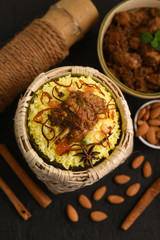 Chicken or Mutton Biryani,  Pulao spicy mixed rice dish with meat curry, almonds during Ramadan...