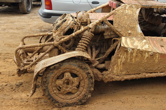 Dirty buggy car rear side view close up after autocross racing