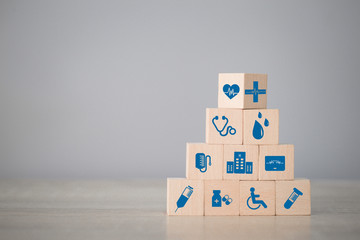 Health Insurance Concept,arranging wood block stacking with icon healthcare medical. - obrazy, fototapety, plakaty