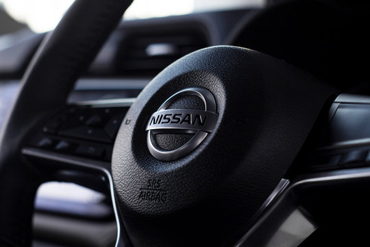 CHIANG RAI, THAILAND-DECEMBER 18, 2018, closeup steering wheel of all new nissan almera car with soft-focus and over light in the background