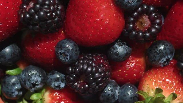 Close-up image of berries isolated, blueberry, strawberry, blackberry