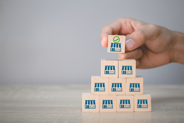 Franchise business concept,hand choose wood blog with franchise marketing.