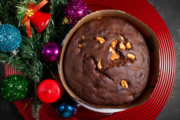 Plum cake made with dried fruit, raisins, cashew nuts, almond etc. Tasty home made cake flavored with cinnamon and spices for sale on Indian Christmas and new year Kerala India.