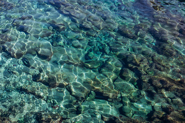 Fototapeta na wymiar Background of turquoise water in the sea. Turquoise water texture with highlights.