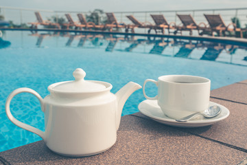 tea set on plate near spa pool