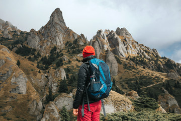 Wanderlust solo traveler in Ciucas mountains, Romania. Most scenic mountain from the Carpathians.