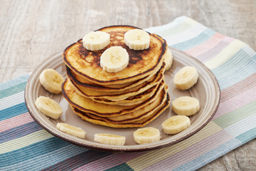 Pancakes with bananas almond and caramel sauce. selective focus.