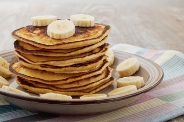 Pancakes with bananas almond and caramel sauce. selective focus.