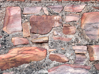 Old castle stone wall as a background or texture. Part of the wall.
