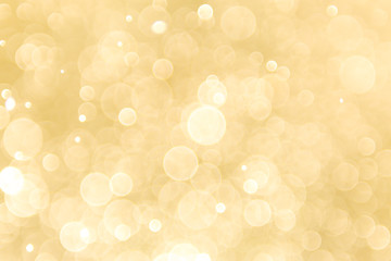 abstract gold background with soft blur bokeh light effect, background bokeh