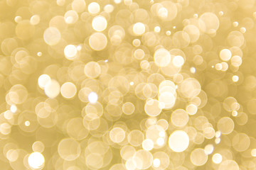 abstract gold background with soft blur bokeh light effect, background bokeh