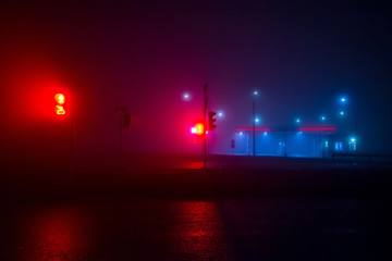Night gas station in the fog
