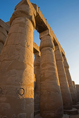 Ancient egyptian hieroglyphic carvings on columns in temple