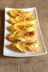 sweet chatter with honey syrup in a white dish