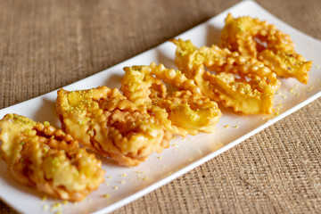 sweet chatter with honey syrup in a white dish