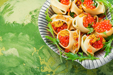 Red caviar filled pasta