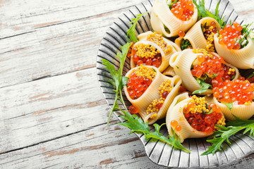 Red caviar stuffed pasta
