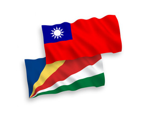 Naklejka premium National vector fabric wave flags of Seychelles and Taiwan isolated on white background. 1 to 2 proportion.