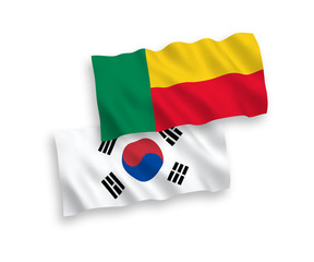 National vector fabric wave flags of South Korea and Benin isolated on white background. 1 to 2 proportion.